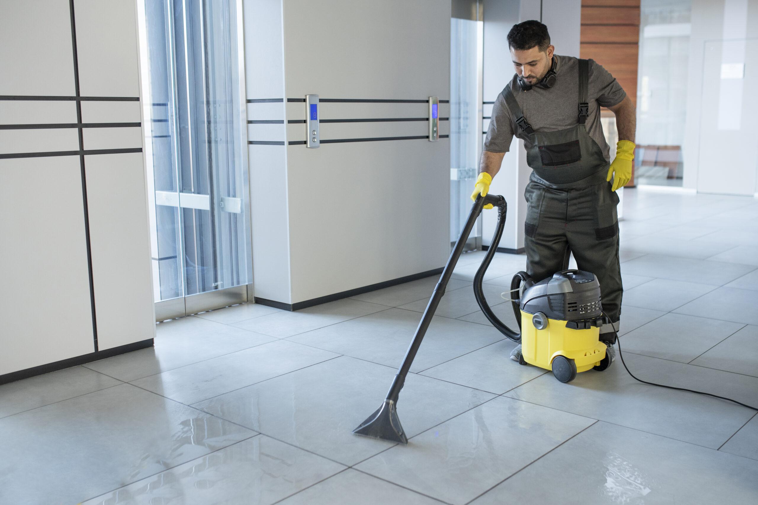 Man cleaning tiled floor